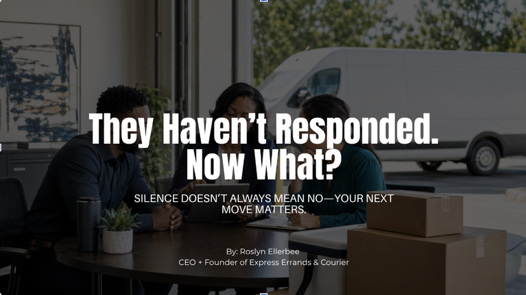 Black woman courier business owner reviewing a delivery quote on a laptop while speaking by phone, with a white cargo van visible outside her office.